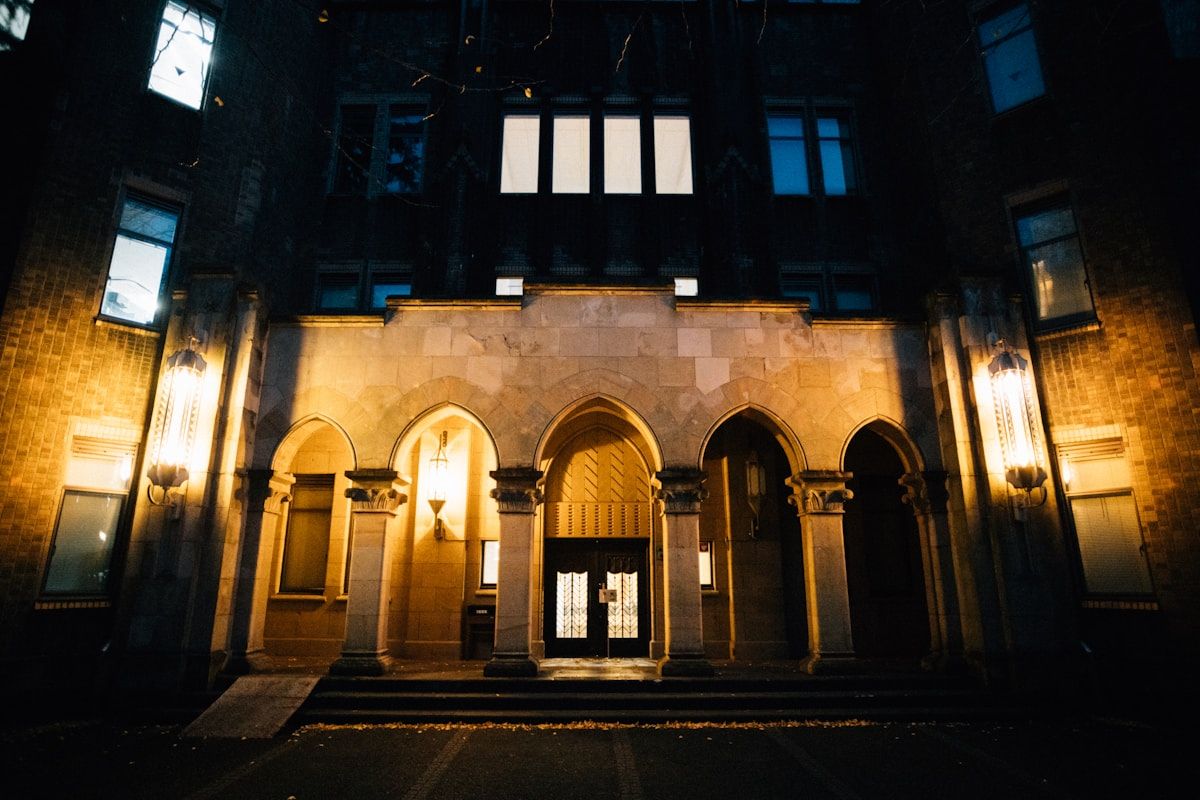 A lit building entrance at night