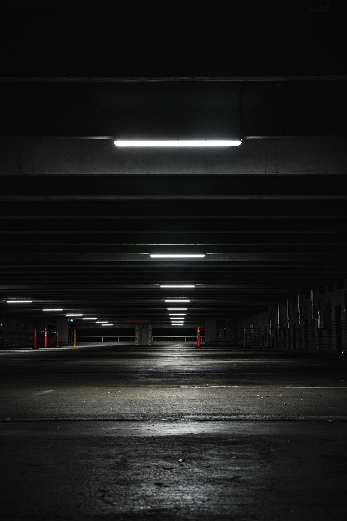 An empty parking structure lit at night